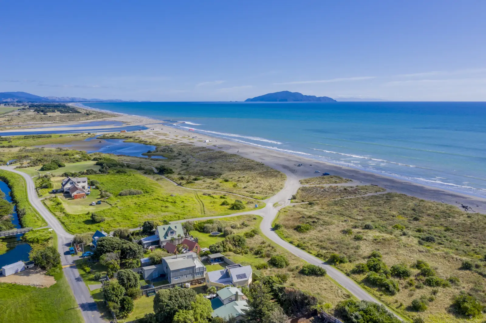 Aerial view of an Australian coastal suburb with homes near the beach